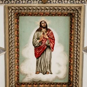 A detailed religious painting of Jesus Christ framed on a decorative ceiling.